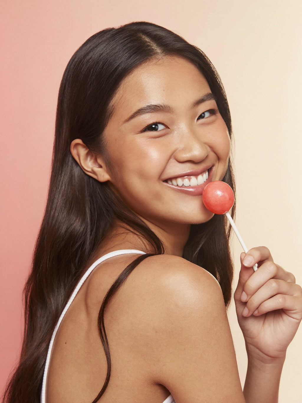 Woman enjoying a VitaPop lollipop